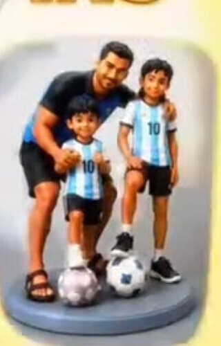3D printed family figurine of a father and two children in football kit with footballs at their feet